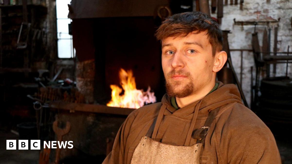 Jay Cardall with a flame behind him