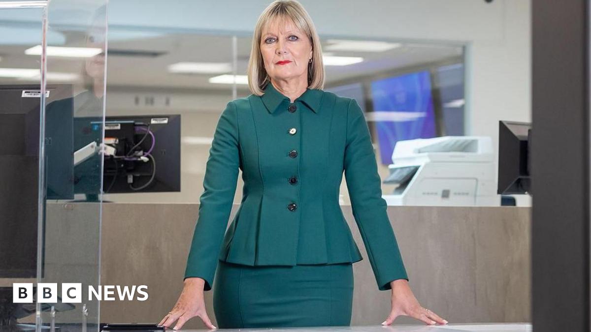 Home Secretary Shabana Mahmood arrives at the BBC in London. She is wearing a turquoise blazer and has a black handbag wrapped over her right shoulder