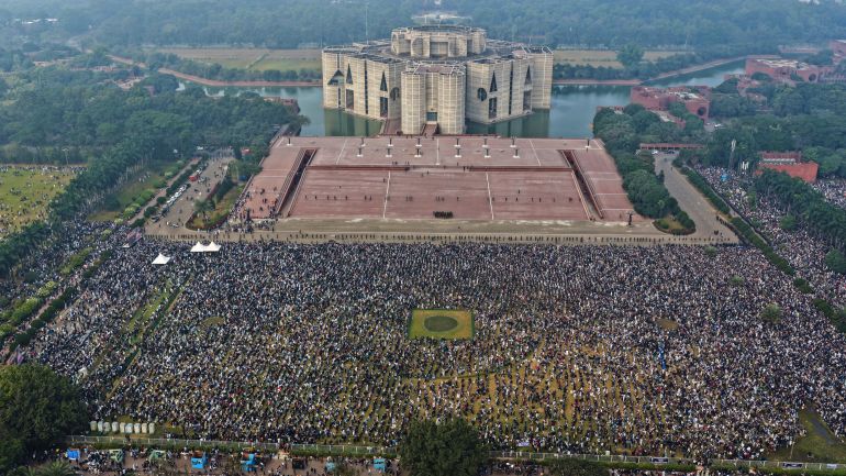 Thousands of people gather to attend funeral prayers for former Prime Minister Khaleda Zia outside the national Parliament building in Dhaka, Bangladesh, Wednesday, Dec. 31, 2025. (AP Photo/Mahmud Hossain Opu)