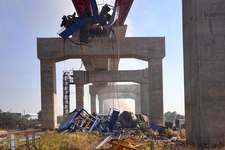 This photo released from State Railway of Thailand, shows a scene after a construction crane fell into a passenger train in Nakhon Ratchasima province, Thailand Wednesday, Jan. 14, 2026. (State Railway of Thailand via AP)