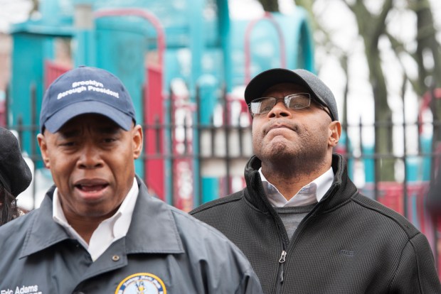Community advocate Tony Herbert, right, listens as Eric Adams speaks in Brownsville, Brooklyn, on Sunday, January 10, 2016. (Debbie Egan-Chin/New York Daily News)
