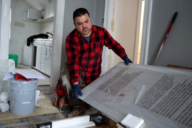 General contractor Pablo Payan, of Merrillville Indiana, renovates a home in Crown Point, Indiana, Jan. 14, 2026. (Antonio Perez/Chicago Tribune)