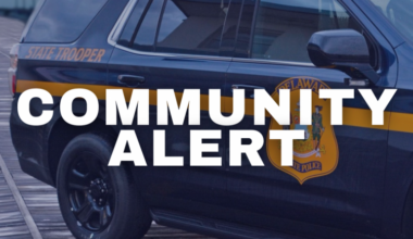 Community Alert text with State Police Tahoe in the background