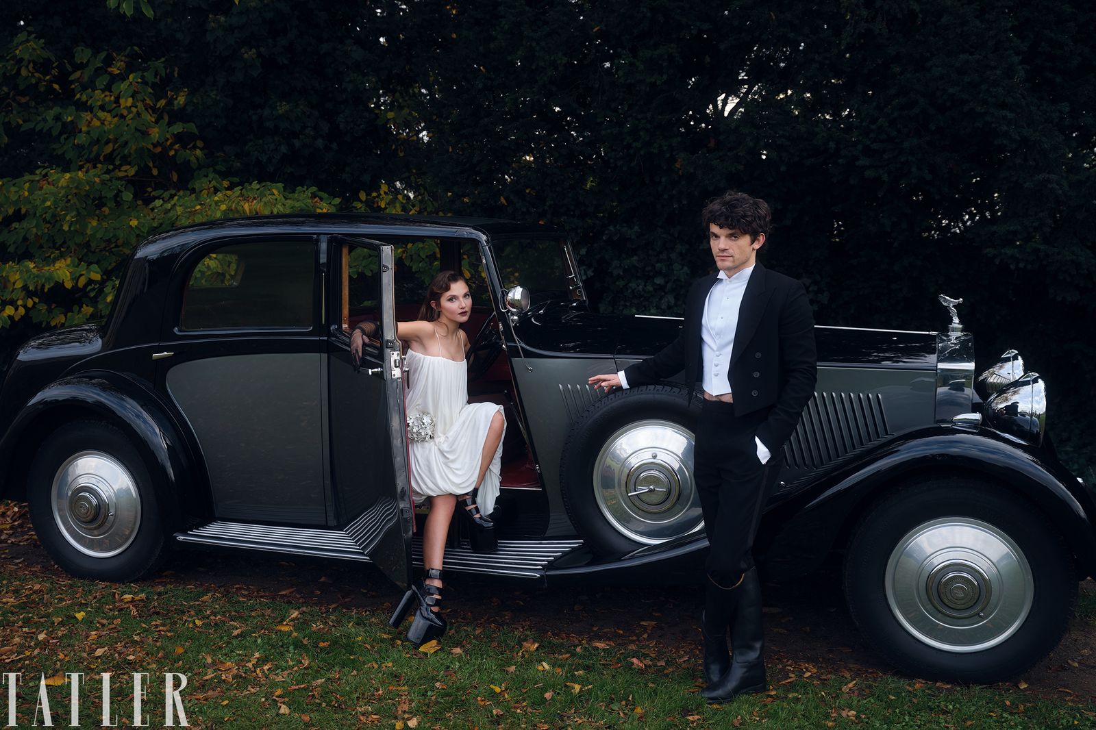 Image may contain Mia MckennaBruce Adult Person Formal Wear Clothing Suit Coat Footwear and Shoe