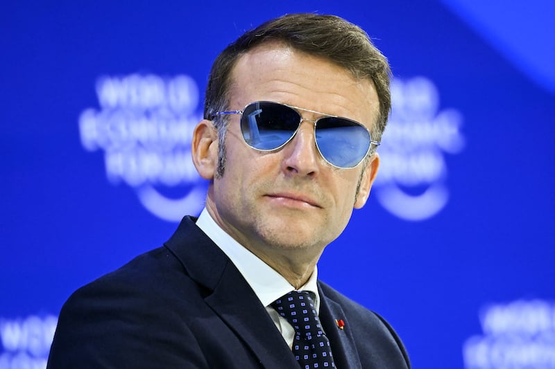 TOPSHOT - France's President Emmanuel Macron looks on during the World Economic Forum (WEF) annual meeting in Davos on January 20, 2026. The World Economic Forum takes place in Davos from January 19 to January 23, 2026. (Photo by Fabrice COFFRINI / AFP via Getty Images)