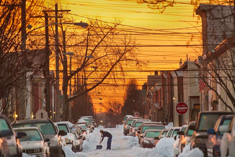 A snow shoveler tackles East Letterly Street in Kensington after almost 2 feet fell upon Philly in January 2016, the city's last double-digit snowfall.