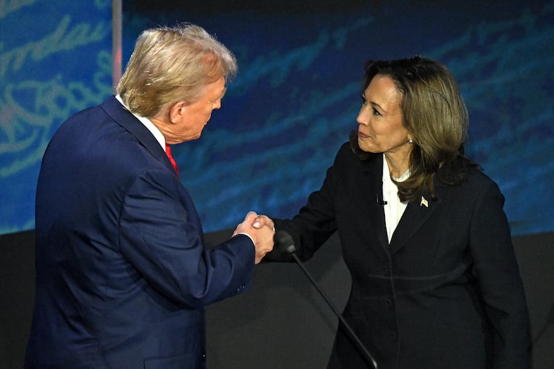 Kamala Harris (R) shakes hands with Donald Trump during a presidential debate at the National Constitution Center in Philadelphia, Pennsylvania, on September 10, 2024.
