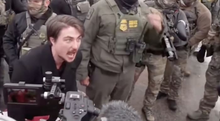 Viral video shows Michigan CEO shouting at protestors