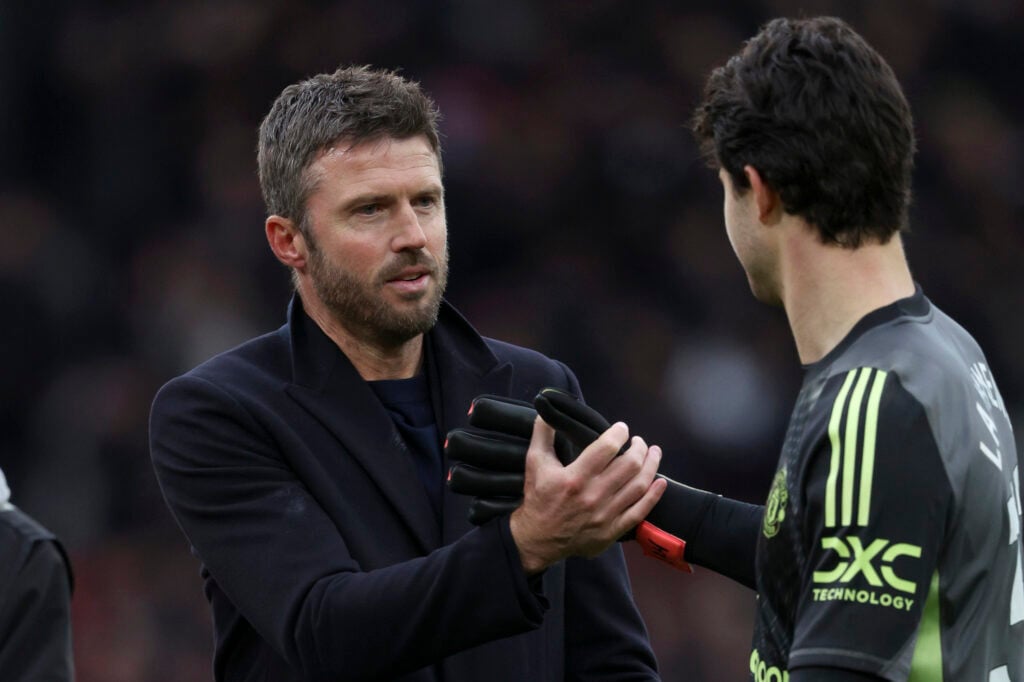 Michael Carrick and Senne Lammens celebrate after the Premier League match between Manchester United and Manchester City at Old Trafford in 2026 in Manchester, England.