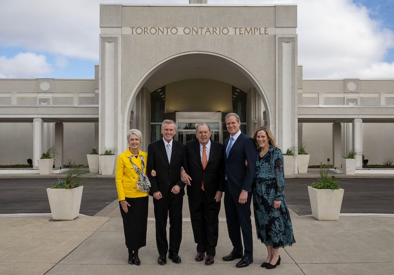 President Jeffrey R. Holland, acting president of the Quorum of the Twelve Apostles, stands in front of the Toronto Ontario Temple on Saturday, March 22, 2025, with Elder Kevin R. Duncan and his wife, Sister Nancy Duncan, left, and Elder Robert M. Daines, a General Authority Seventy and second counselor in the North America Northeast Area presidency, and his wife, Sister Ruth Ann Daines, right.