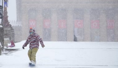 Alex Yhr, 26, snowboards down the steps in front of the Philadelphia Museum of Art with his friend Miheer Pujara in Philadelphia, Saturday, Jan. 23, 2016. The two medical school student studying at Thomas Jefferson University decided to snow board the steps after seeing YouTube videos of people sledding there in 2015.