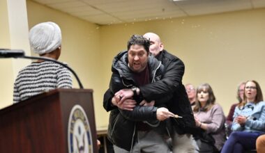 Man sprays unknown substance on Ilhan Omar during Minneapolis town hall