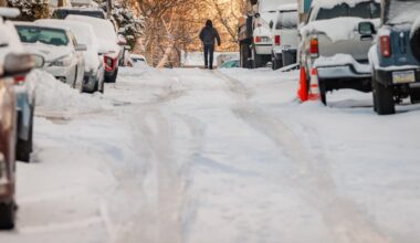 A Pedestrian walks on the snow and ice in Manayunk Monday. More snow is possible this weekend.