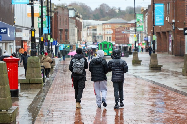 People in Walsall town centre West Midlands. Walsall the worst place in Britain for quality of life in 2025 according to 2025 good Growth for Cities Index. // Residents of Britain's worst town for quality of life says its like living in "real-life episode of Shameless" where beggars earn more money than them by sitting outside a Wetherspoons. The Black Country town of Walsall, West Mids, was ranked the most deprived town in the UK in the 2025 Good Growth for Cities Index. It was once the centre of the UK's leather trade, with scores of shopping chains and independent shops, but has now descended into a "war-zone." Locals say they are too scared to walk the streets, which have become no-go zones after dark, due to "feral" youths, gang violence and drug addicts. Grim photos taken this week show how the town has descended into a "slum" - from dumped rubbish, boarded up houses and a surging homeless population. Photo released 19/01/2026