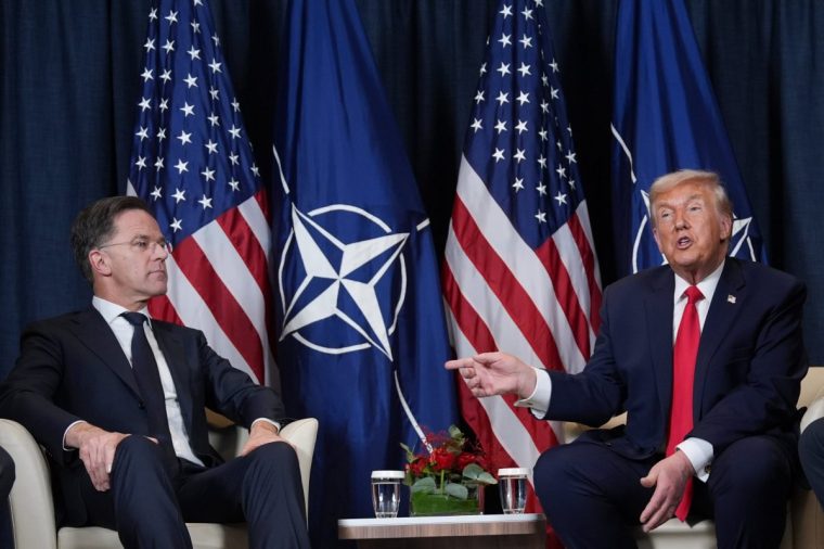 President Donald Trump, right, meets with NATO Secretary General Mark Rutte during a meeting on the sidelines of the Annual Meeting of the World Economic Forum in Davos, Switzerland, Wednesday, Jan. 21, 2026. (AP Photo/Evan Vucci)