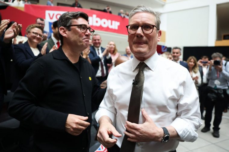 Keir Starmer, leader of the Labour Party, right, and Andy Burnham, mayor of Manchester, during the launch of the party's general election manifesto in Manchester, UK, on Thursday, June 13, 2024. Labour looks set to reiterate key pledges including a cap on corporation tax at the current rate of 25%, and a commitment not to increase income tax, national insurance or VAT. Photographer: Hollie Adams/Bloomberg via Getty Images