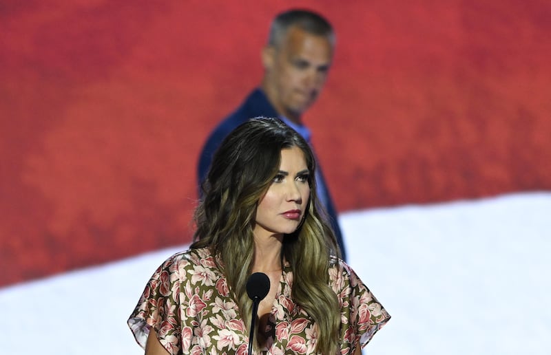 Kristi Noem takes part in a sound check as political commentator Corey Lewandowski looks on at the Fiserv Forum ahead of the 2024 Republican National Convention on July 14, 2024 in Milwaukee, Wisconsin.