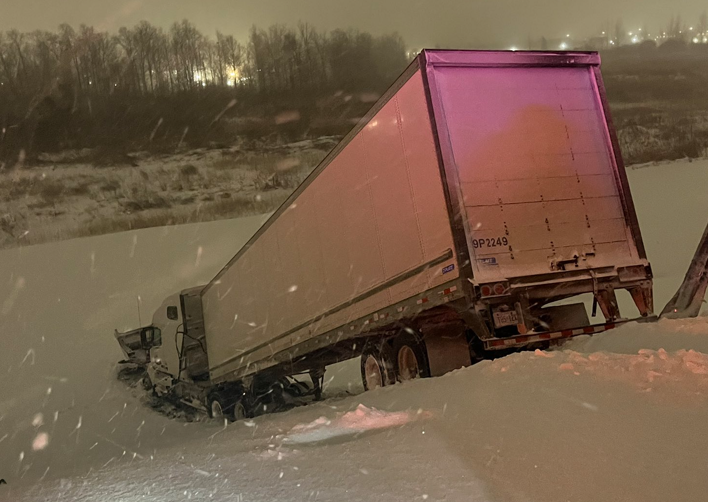 A truck rolls into a 30m ditch and the driver is rescued using a rope at 4 a.m in London.