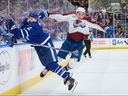 Maple Leafs defenceman Simon Benoit (2) collides with Colorado Avalanche forward Jack Drury (18) in Toronto on Sunday.
