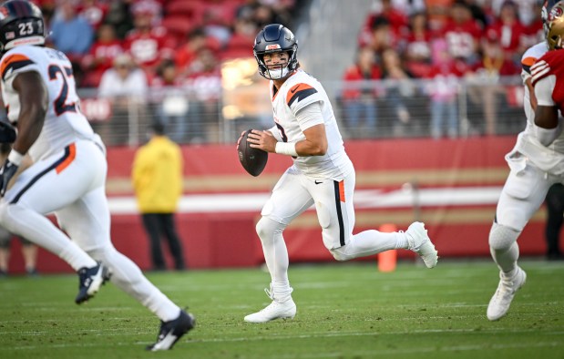 Jarrett Stidham (8) of the Denver Broncos looks for an open man against the San Francisco 49ers during the third quarter at Levi's Stadium in Santa Clara, California on Saturday, Aug. 9, 2025. (Photo by AAron Ontiveroz/The Denver Post)