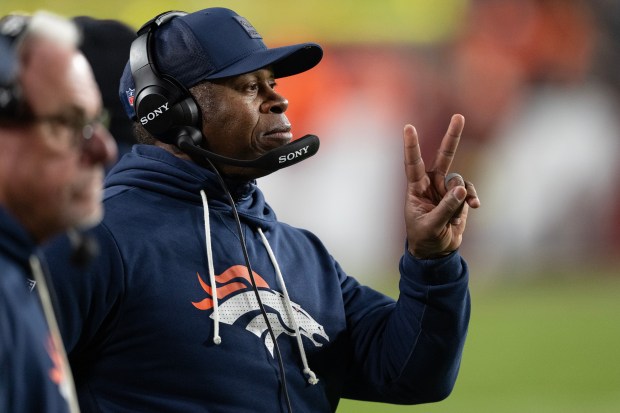 Broncos defensive coordinator Vance Joseph throws the deuces to his squad during a game against the Washington Commanders on Sunday, Nov. 30, 2025, at Northwest Stadium in Landover, Maryland. (Photo by Timothy Hurst/The Denver Post)