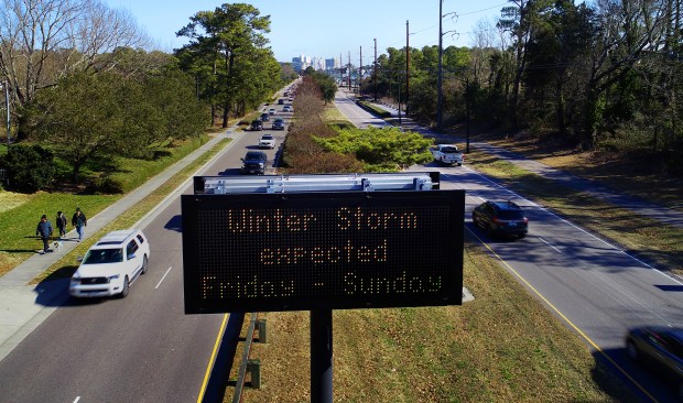 A traffic sign along Shore Drive in Virginia Beach warns drivers of impending winter weather this weekend. As seen Thursday, Jan. 29, 2026. (Stephen M. Katz / The Virginian-Pilot)