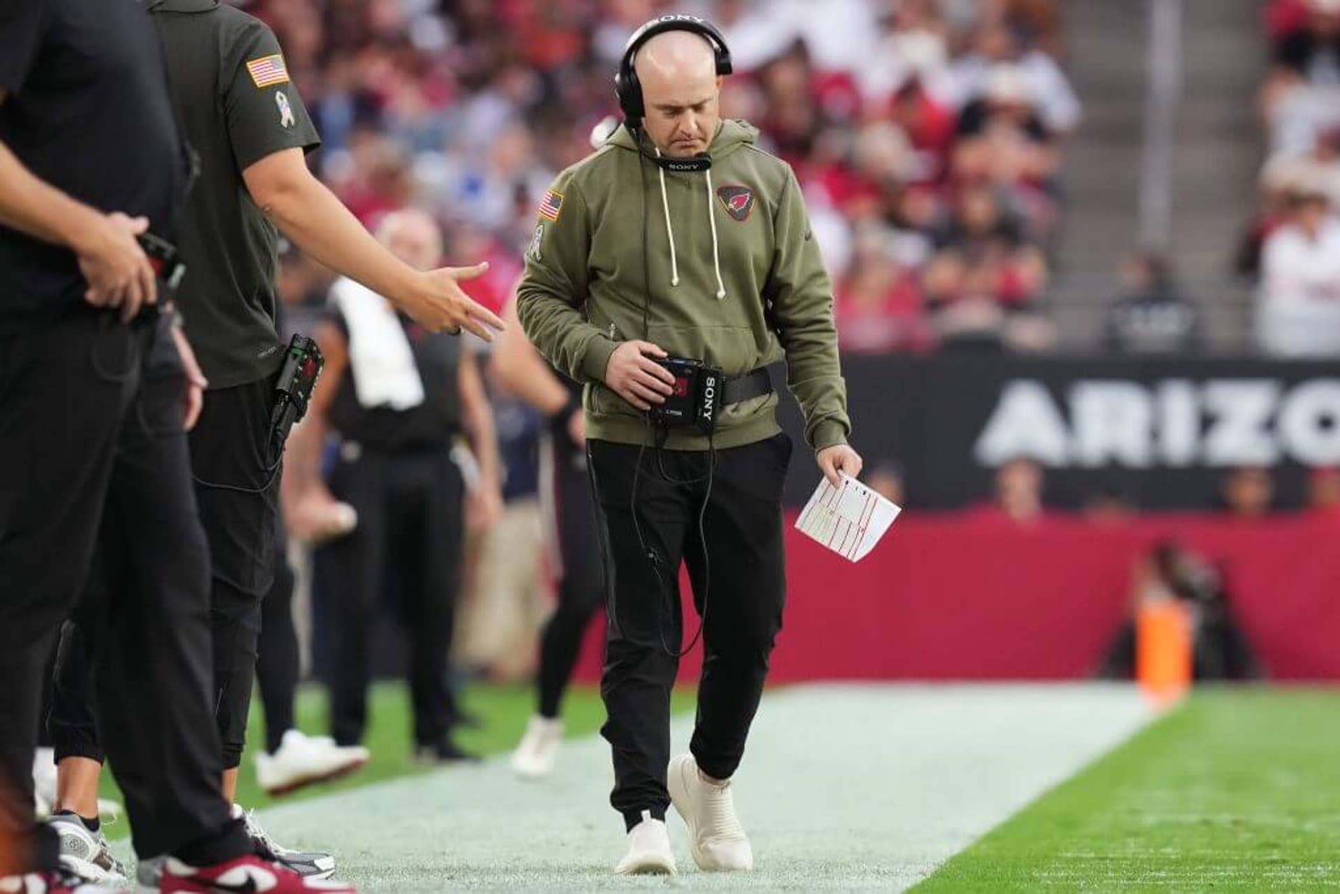 Arizona Cardinals offensive coordinator Drew Petzing walks the sidelines as they play the San Francisco 49ers at State Farm Stadium in Glendale.
