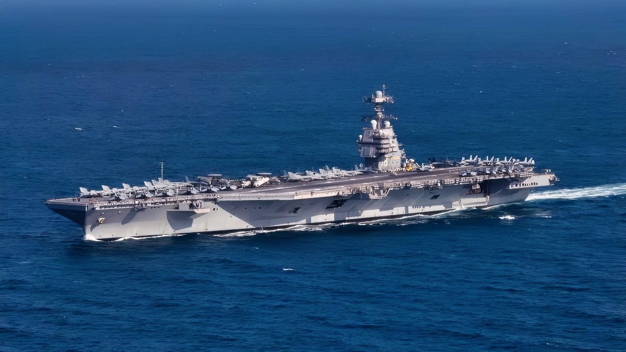 Oct. 9, 2022 - The first-in-class aircraft carrier USS Gerald R. Ford (CVN 78) steams the Atlantic Ocean during a simulated straits transit with the Gerald R. Ford Carrier Strike Group (GRFCSG) in the Atlantic Ocean, Oct. 9, 2022. The Gerald R. Ford Carrier Strike Group is deployed in the Atlantic Ocean, conducting training and operations alongside NATO Allies and partners to enhance integration for future operations and demonstrate the U.S. Navy's commitment to a peaceful, stable and conflict-free Atlantic region. (U.S. Navy photo by Mass Communication Specialist 2nd Class Jackson Adkins)