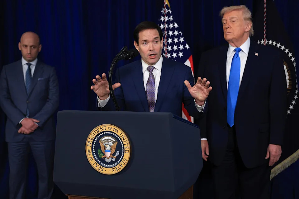Secretary of State Marco Rubio addresses a press conference as President Trump stood to his side with his eyes closed, at Mar-a-Lago on Jan. 3, 2026, in Palm Beach, Florida. / Joe Raedle/Getty Images