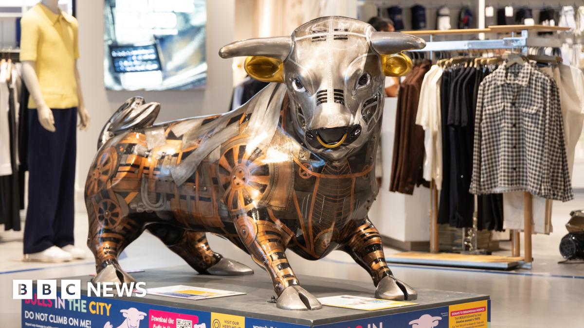 A generic image of a nurse holding an elderly person's hand while they are lying in bed