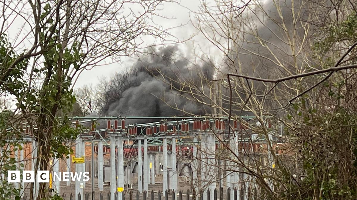 Grey smoke seen behind an electrical substation