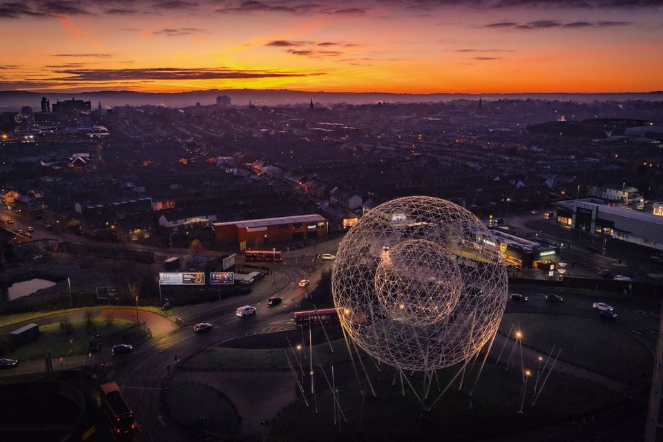 The final sunrise of 2025 over the ‘Rise’ sculpture at Broadway, straddling south and west Belfast on December 31st 2025 (Photo by Kevin Scott)