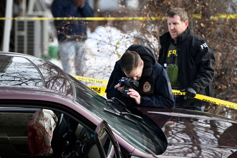MINNEAPOLIS, MINNESOTA - JANUARY 07: Members of law enforcement photograph a vehicle suspected to be involved in a shooting by an ICE agent during federal law enforcement operations on January 07, 2026 in Minneapolis, Minnesota. According to federal officials, the agent, “fearing for his life” killed a woman during a confrontation in south Minneapolis. Stephen Maturen/Getty Images/AFP (Photo by Stephen Maturen / GETTY IMAGES NORTH AMERICA / Getty Images via AFP)