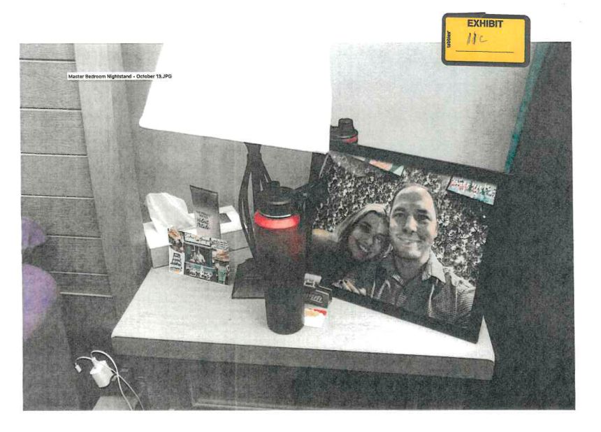 This image, provided by the Fairfax County Police Department and taken on October 13, 2023, shows a framed photo of Brendan Banfield and Juliana Peres Magalhães on his bedside table in Herndon, Virginia.
