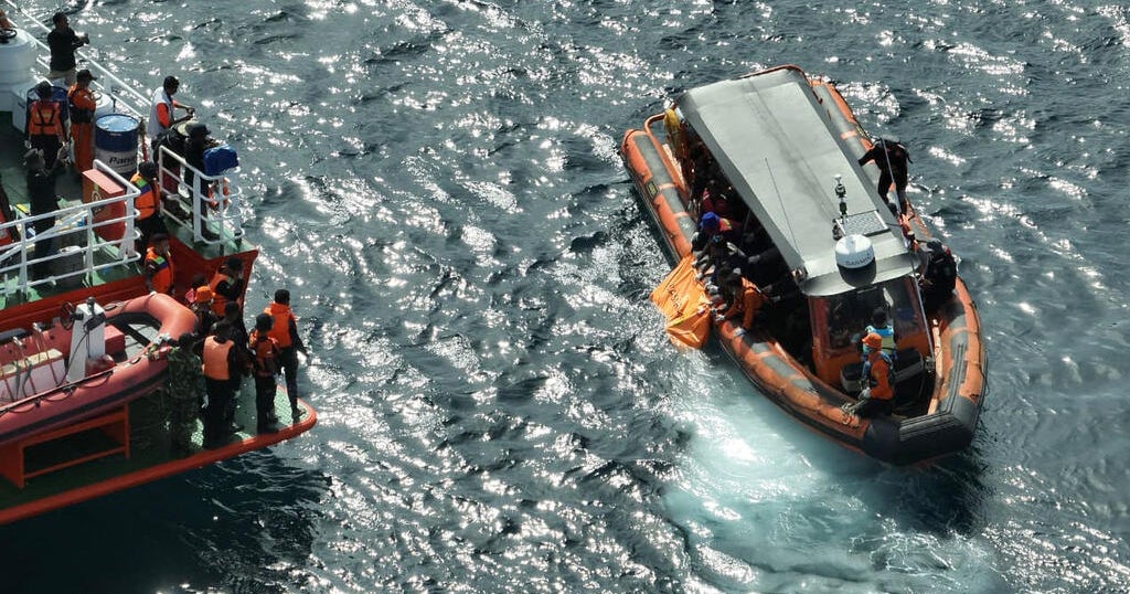 Indonesian rescuers find second body as search for Spanish soccer coach and 2 children continues