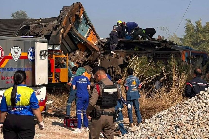 Rescue workers are shown responding after a construction crane fell on passenger train in northeast Thailand in an image released by State Railway of Thailand.