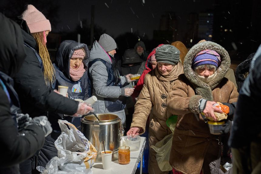 Saint'Egidio Christian community volunteers give out free hot meals to elderly people in Kyiv, Ukraine, on January 23.