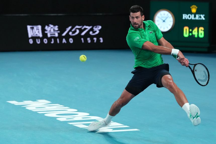 Djokovic plays a backhand return during his semifinal match Friday.
