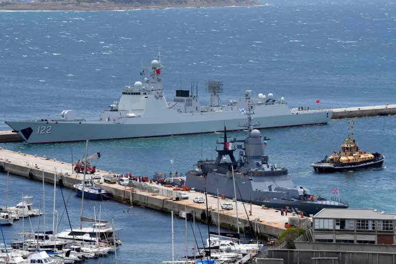 The Chinese guided-missile destroyer Tangshan, left, and the Russian corvette Stoikiy, right, in the Simon's Town harbour, in Cape Town, South Africa, Friday, Jan. 9, 2026. (AP Photo/Nardus Engelbrecht)