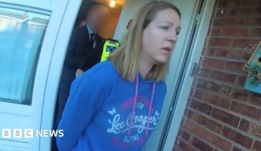 Screen grab taken from body worn camera footage issued by Cheshire Constabulary of the arrest of Lucy Letby. She is wearing a blue Lee Cooper hoody and has shoulder length blonde hair.