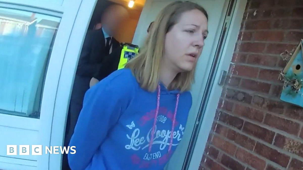 Screen grab taken from body worn camera footage issued by Cheshire Constabulary of the arrest of Lucy Letby. She is wearing a blue Lee Cooper hoody and has shoulder length blonde hair.