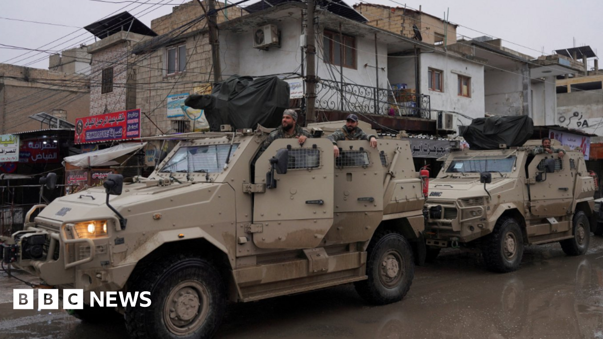 Syrian army military vehicles are deployed inside the city of Tabqa, after the withdrawal of the Syrian Democratic Forces, 18 January 2026