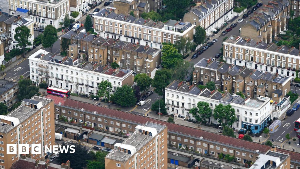 An aerial shot of tower blocks and houses