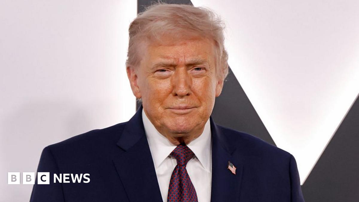 In front of a red background, Sir Keir Starmer delivers remarks at a UK-China Business Forum in Beijing