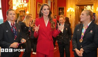 The Princess of Wales holds a white England rugby shirt and is speaking to Zoe Stratford