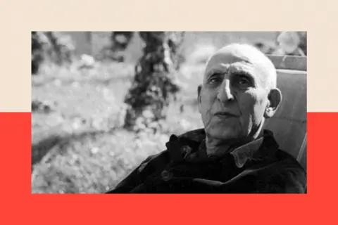 Universal Images Group via Getty Images Deposed Iranian Prime Minister Mohammad Mossadeq sits on a recliner in a garden, wearing a dark corduroy jacket