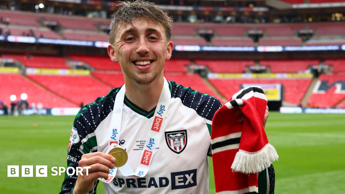 Dan Neil holds his medal at Wembley following Sunderland's victory over Sheffield United