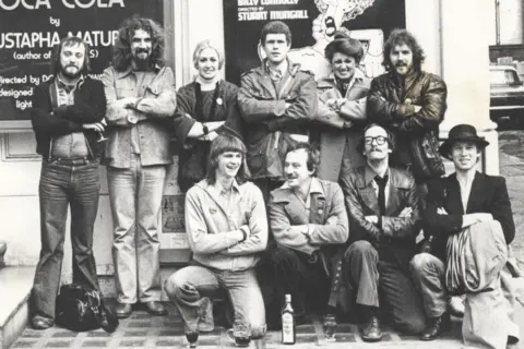 RCS A black and white photo of a group of students in the 1970s, with Connolly standing second from the left. There are six students standing and four are kneeling in the front.