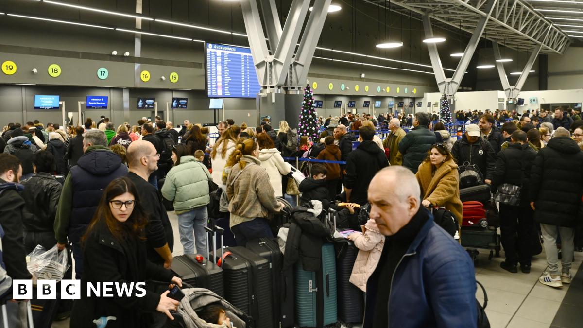 Passengers wait at the Thessaloniki Airport "Makedonia" amidst disruption in flights across Greece linked to a technical problem