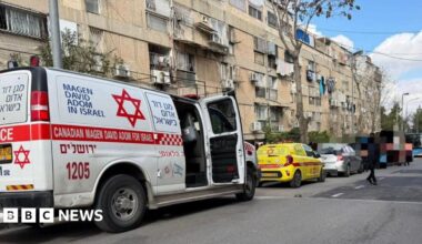 Magen David Adom ambulance and other vehicles on a street in north-west Jerusalem, near a daycare centre where two babies died (19 January 2026)